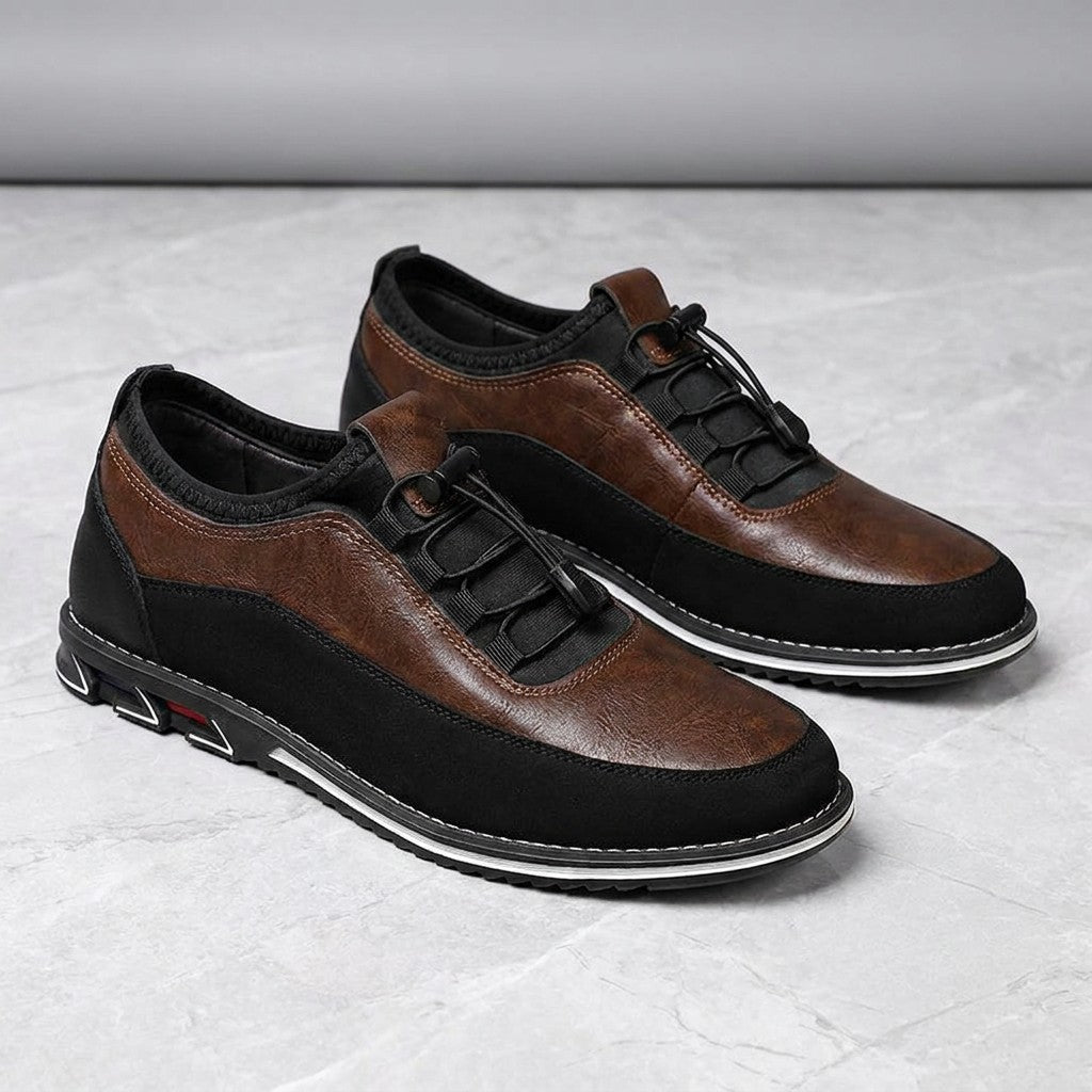 Sutri Leather Slip-On Shoes — Chestnut Brown, pair in three-quarter view on light-grey marble