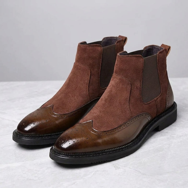Montefalco Brogue Chelsea Boots — Brown, pair of Chelsea boots, three-quarter view on light grey marble