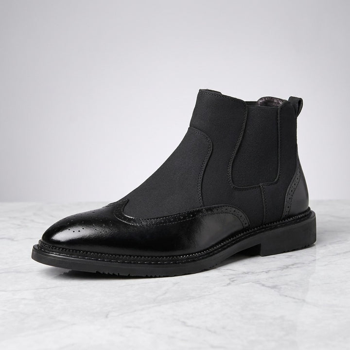 Montefalco Brogue Chelsea Boots — Black, single boot in side profile on light grey marble