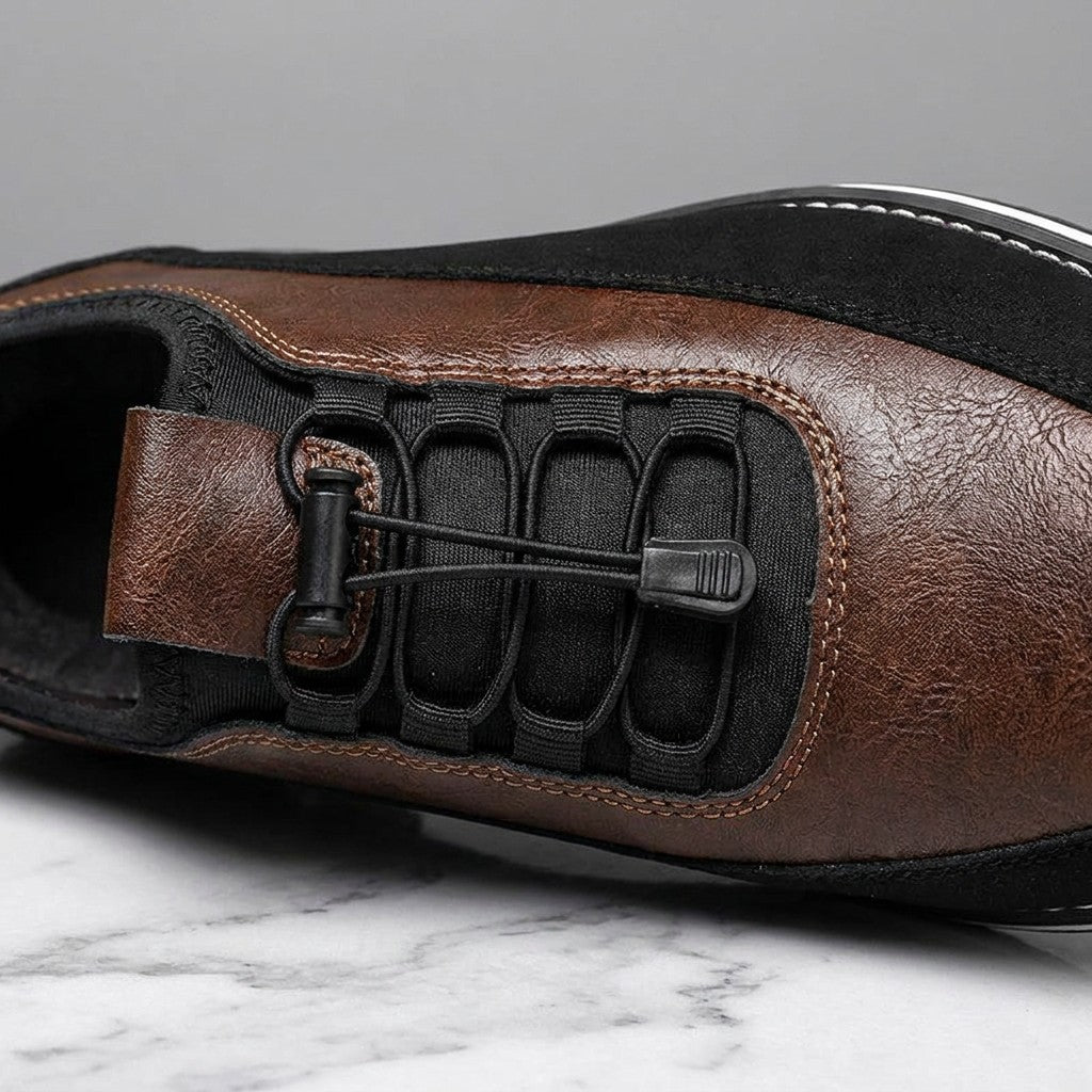 Sutri Leather Slip-On Shoes — Chestnut Brown, close-up of the elastic no-tie laces and stitched upper on light-grey marble