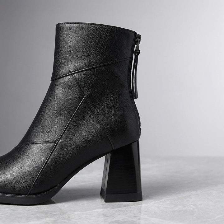 Tropea Paneled Ankle Boots — Black, close-up of the paneled upper, back zip and block heel