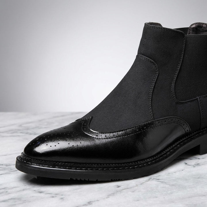 Montefalco Brogue Chelsea Boots — Black, close-up of the brogue toe cap, suede shaft and elastic side panel