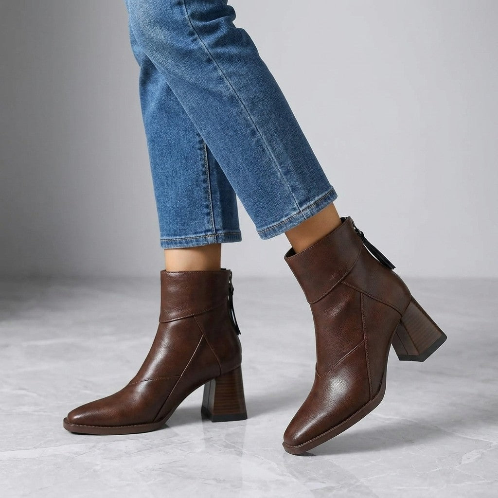 Tropea Paneled Ankle Boots — Brown, worn with cropped blue jeans, knee-down on light grey marble
