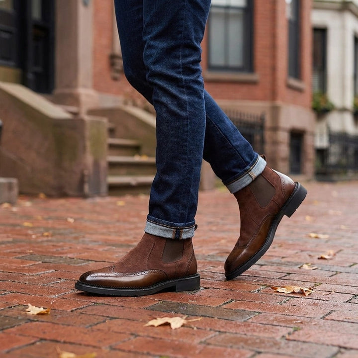 Montefalco Brogue Chelsea Boots — Brown, worn with cuffed dark jeans on a brick sidewalk in Boston&