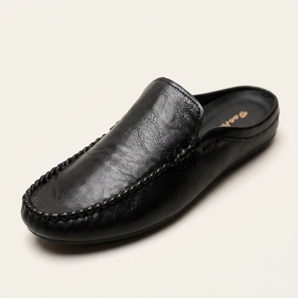 Cetara Leather Mules — Black, three-quarter studio view