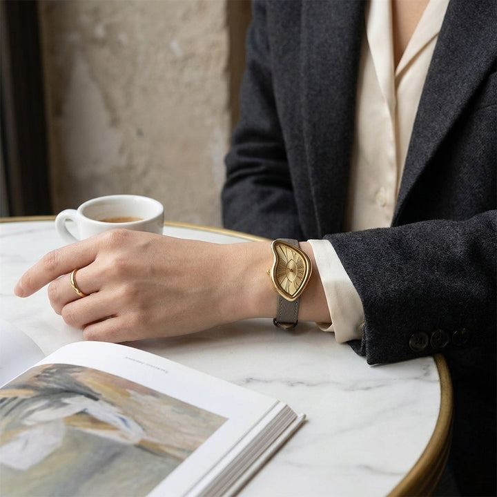 Navona Twisted Watch — Grey, worn at a cafe table