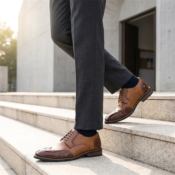 Urbino Leather Wingtip Brogues — Cognac, worn on stone steps