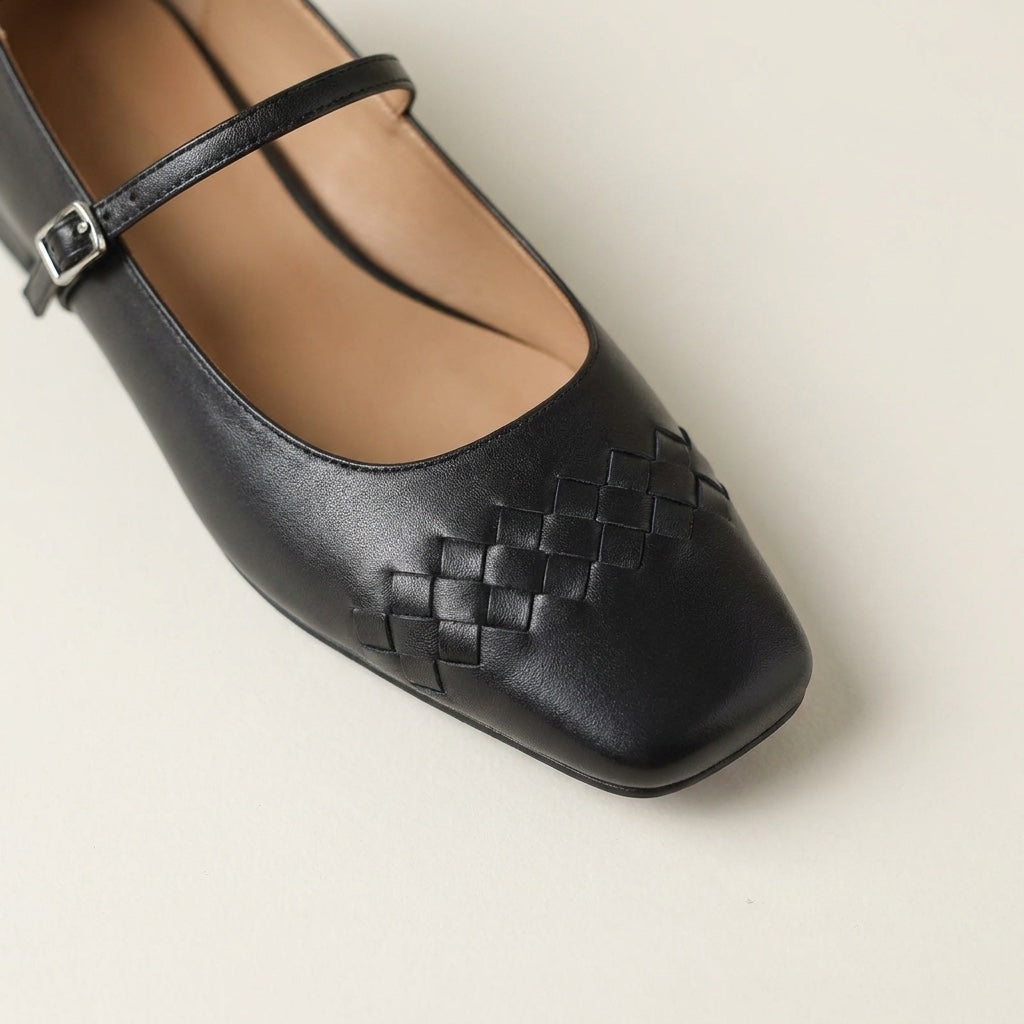 Verona Mary Janes — Black, close view of the woven toe and buckle