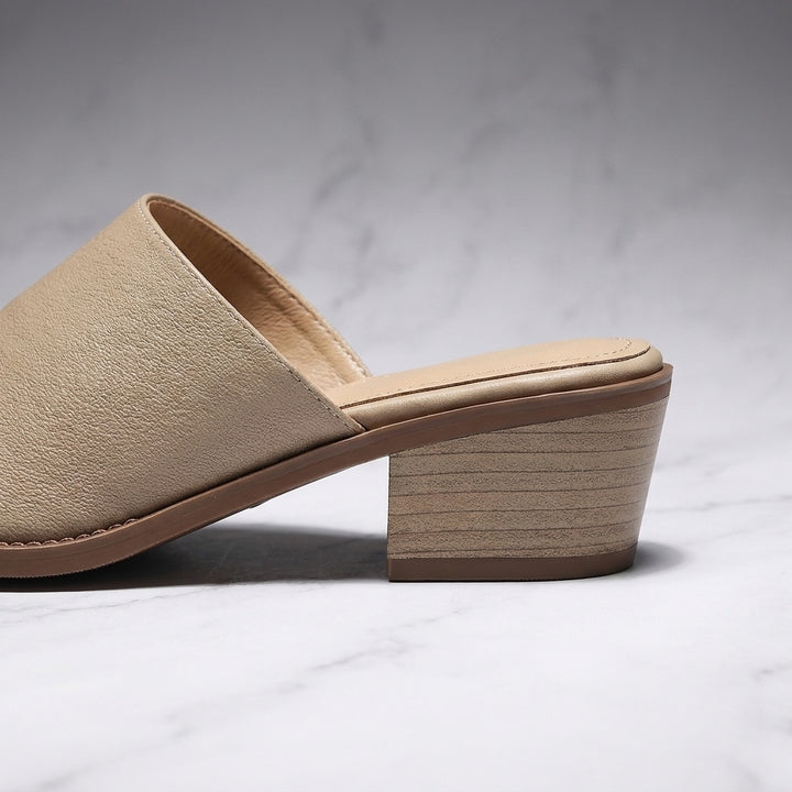 Sabina Leather Mules — Sand, close-up of the block heel and stitched sole edge