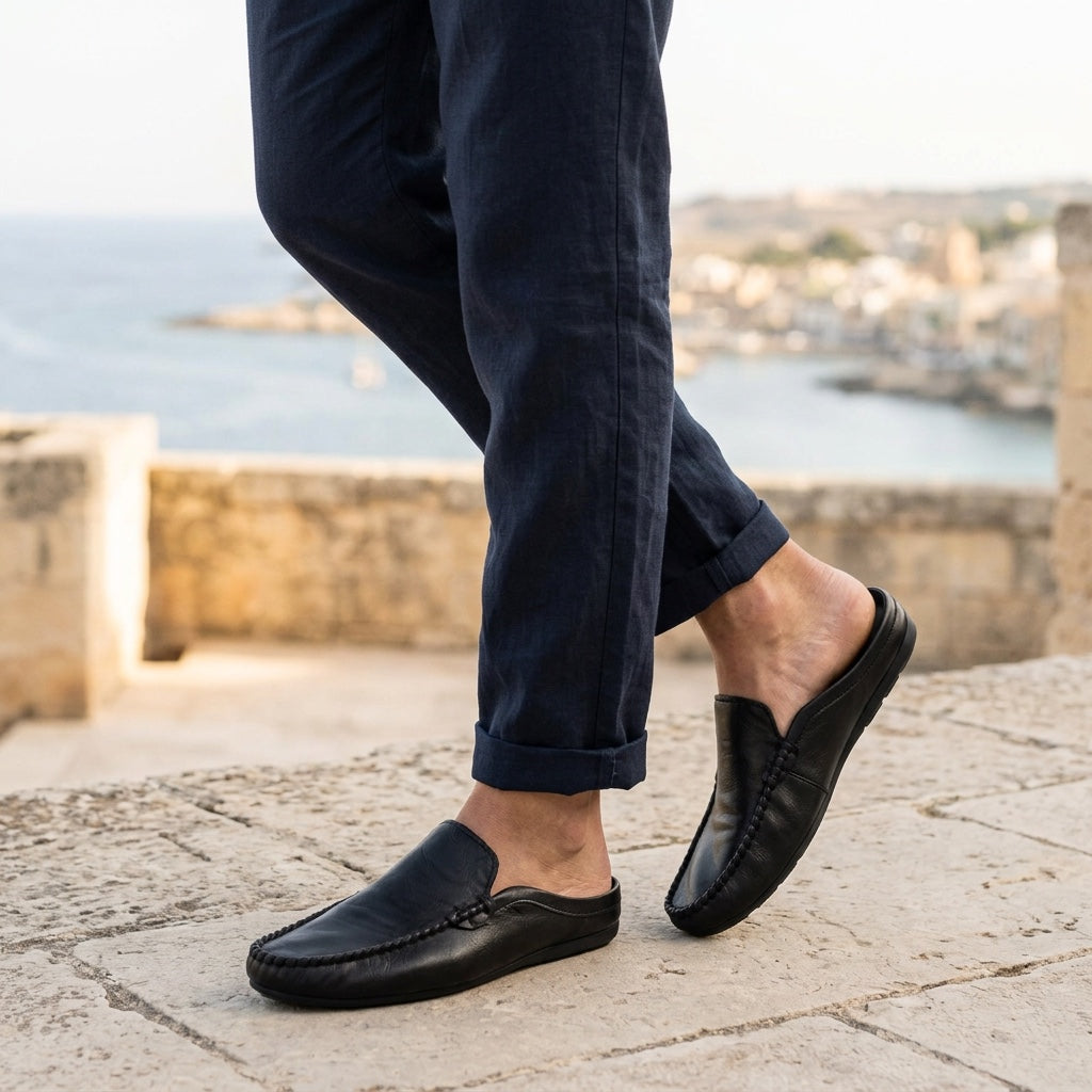 Cetara Leather Mules — Black, coastal terrace lifestyle