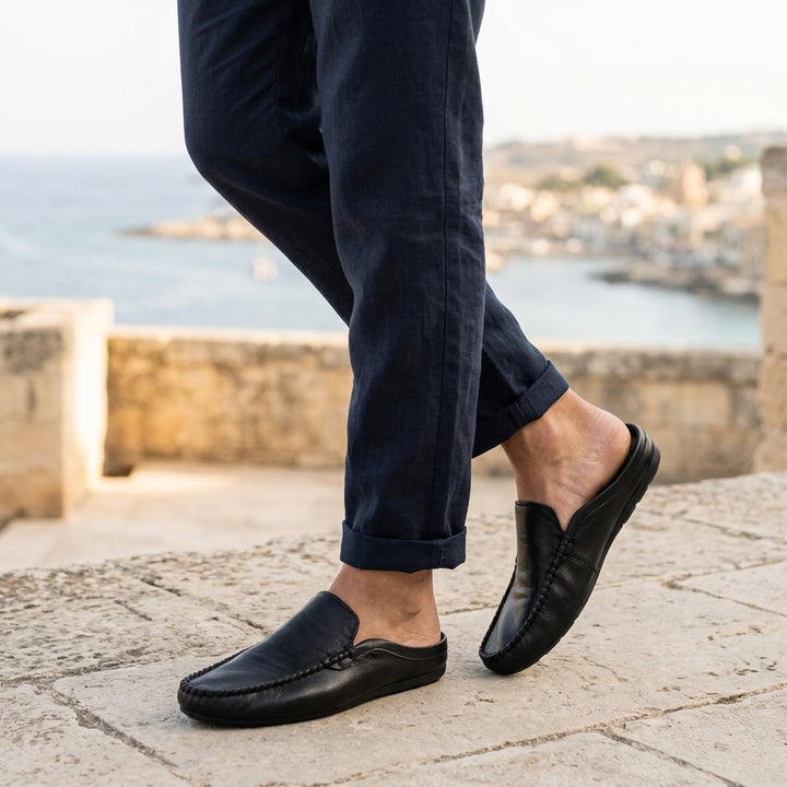 Cetara Leather Mules — Black, coastal terrace lifestyle