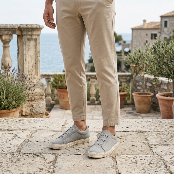 Ponza Espadrille Sneakers — Grey, worn on a coastal stone terrace