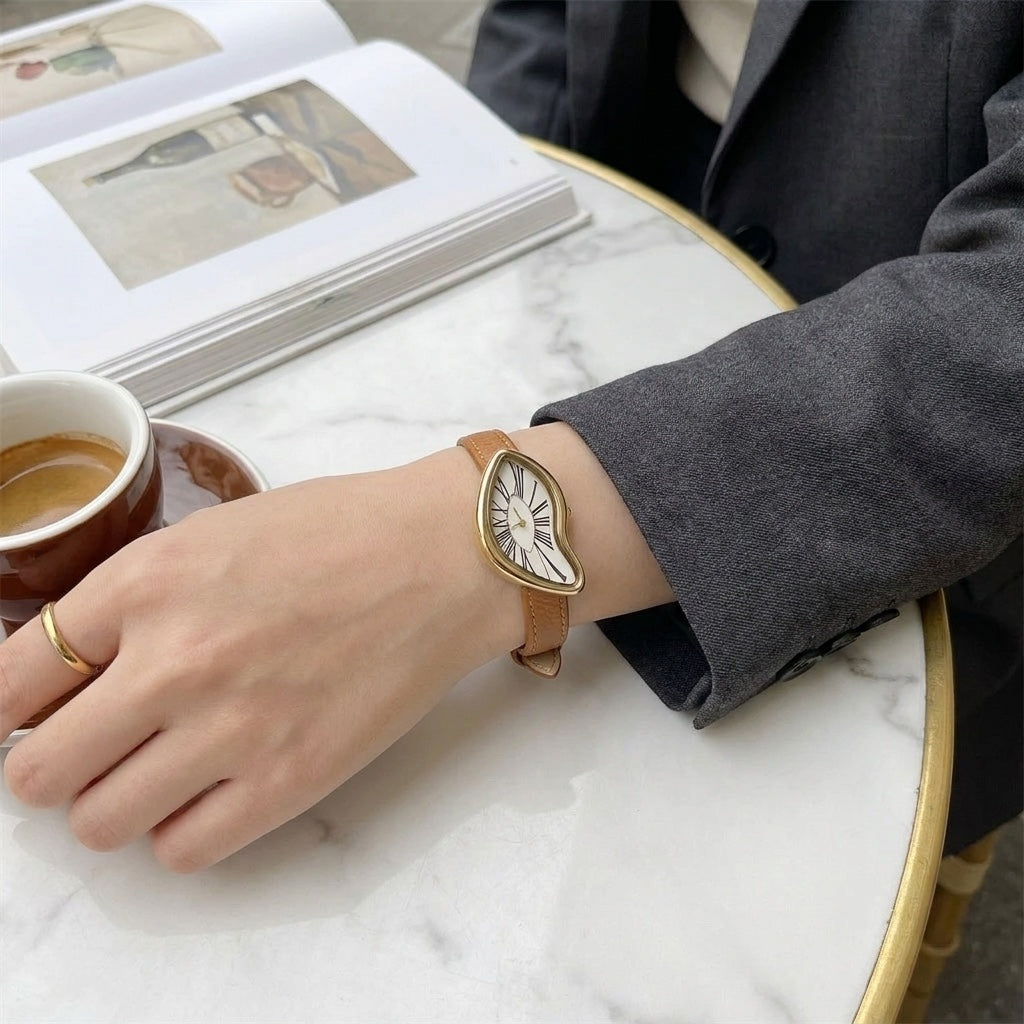Navona Twisted Watch — Tan, worn at a cafe table