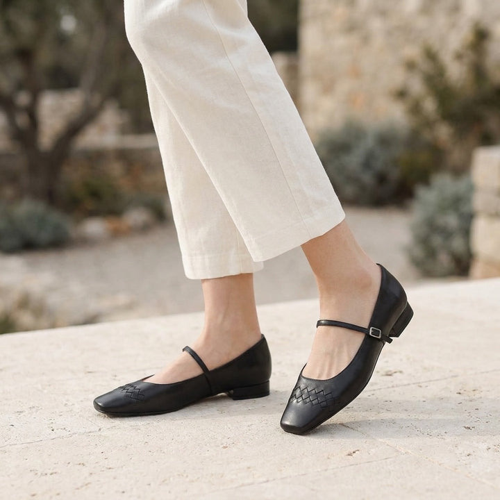 Verona Mary Janes — Black, worn outdoors on a stone terrace, from the knee down