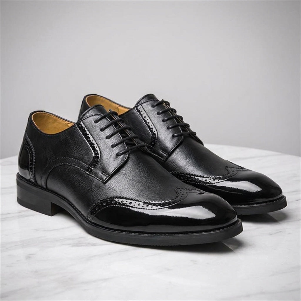 Urbino Leather Wingtip Brogues — Black, three-quarter studio view of the pair