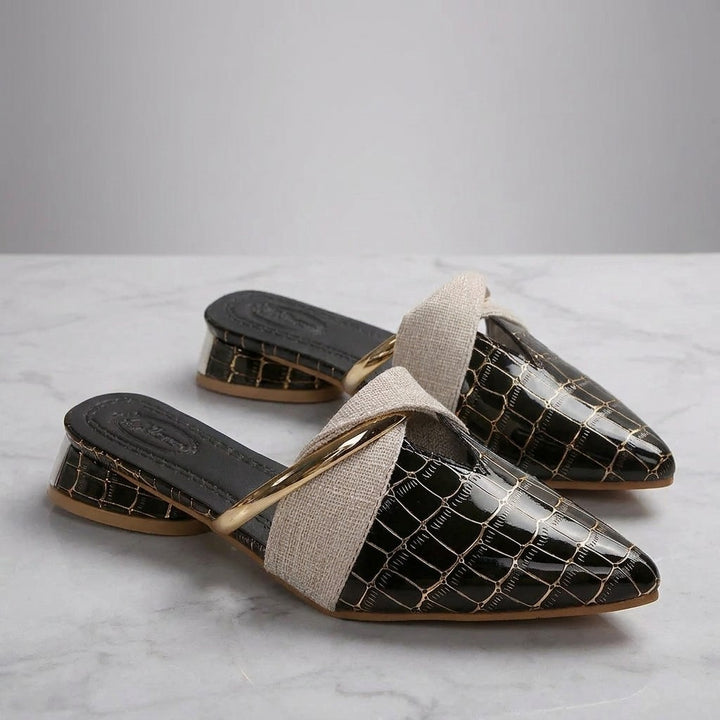 Orvieto Croc-Embossed Mules — Black, pair on marble