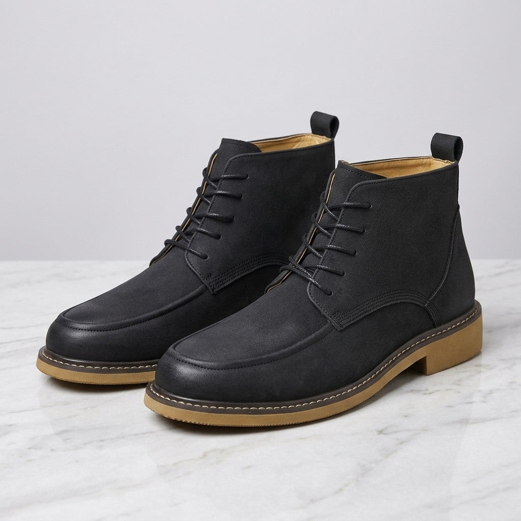 Trento Leather Boots — Black, pair on marble