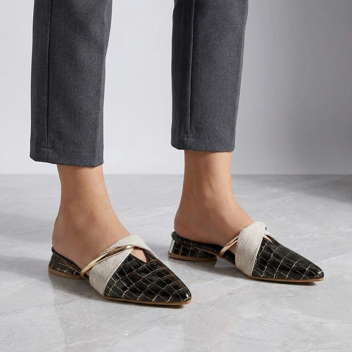 Orvieto Croc-Embossed Mules — Black, on model knee-down studio