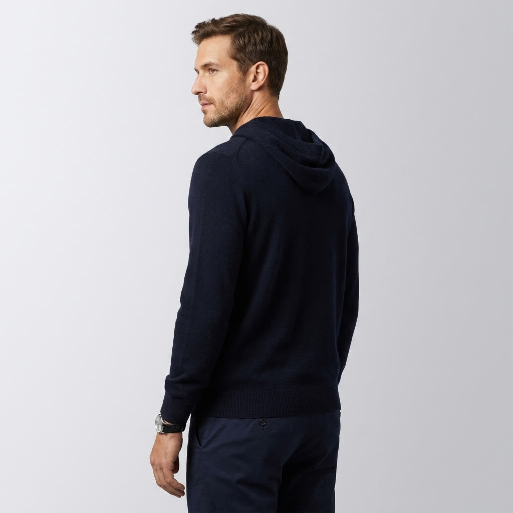 Nomad Merino Wool Hoodie — Black, three-quarter back on millennial model