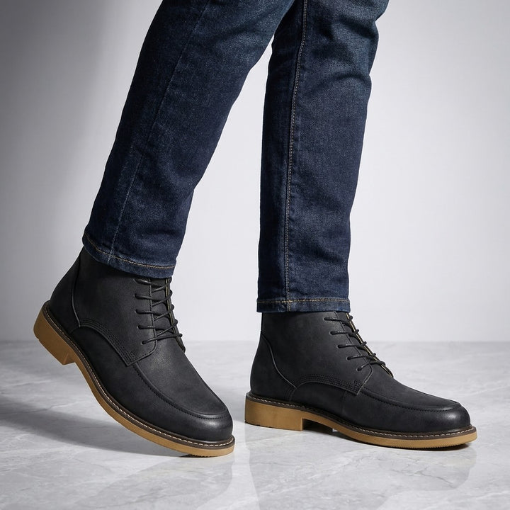 Trento Leather Boots — Black, on model knee-down studio