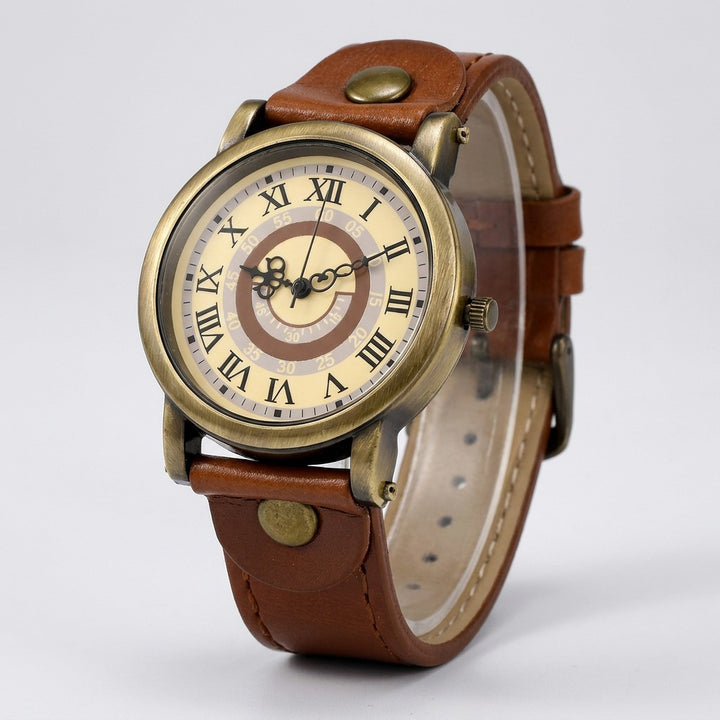 Sabaudia Vintage Watch — Bronze / Tan, cream Roman-numeral dial on a light-grey studio backdrop