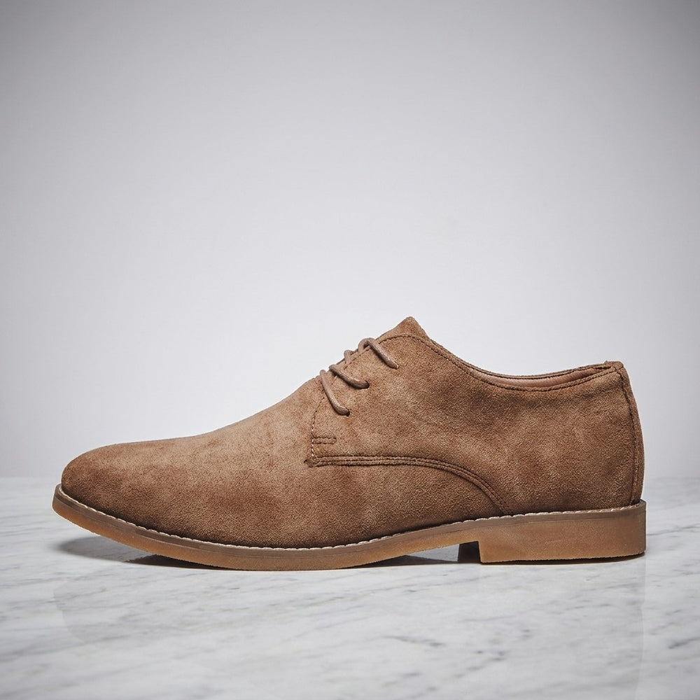 Men's Classic Suede Oxfords — Brown, side profile on marble