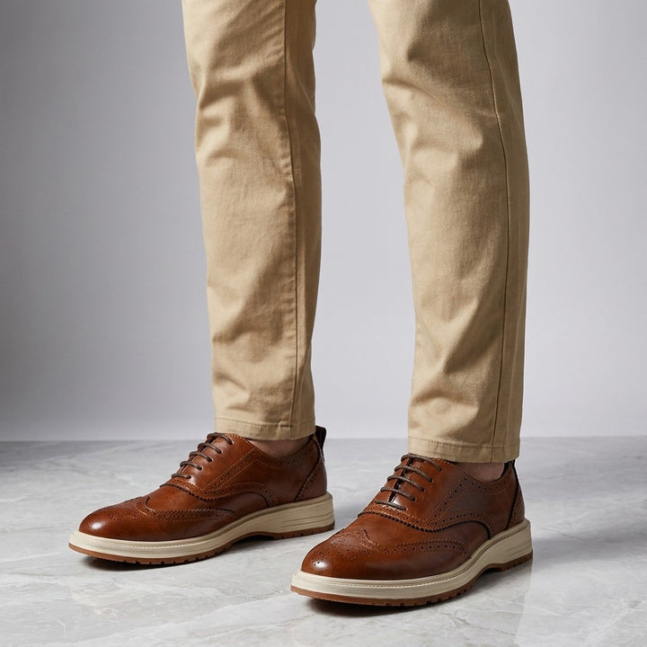 Trieste Brogue Sneakers — Brown, on model knee-down studio