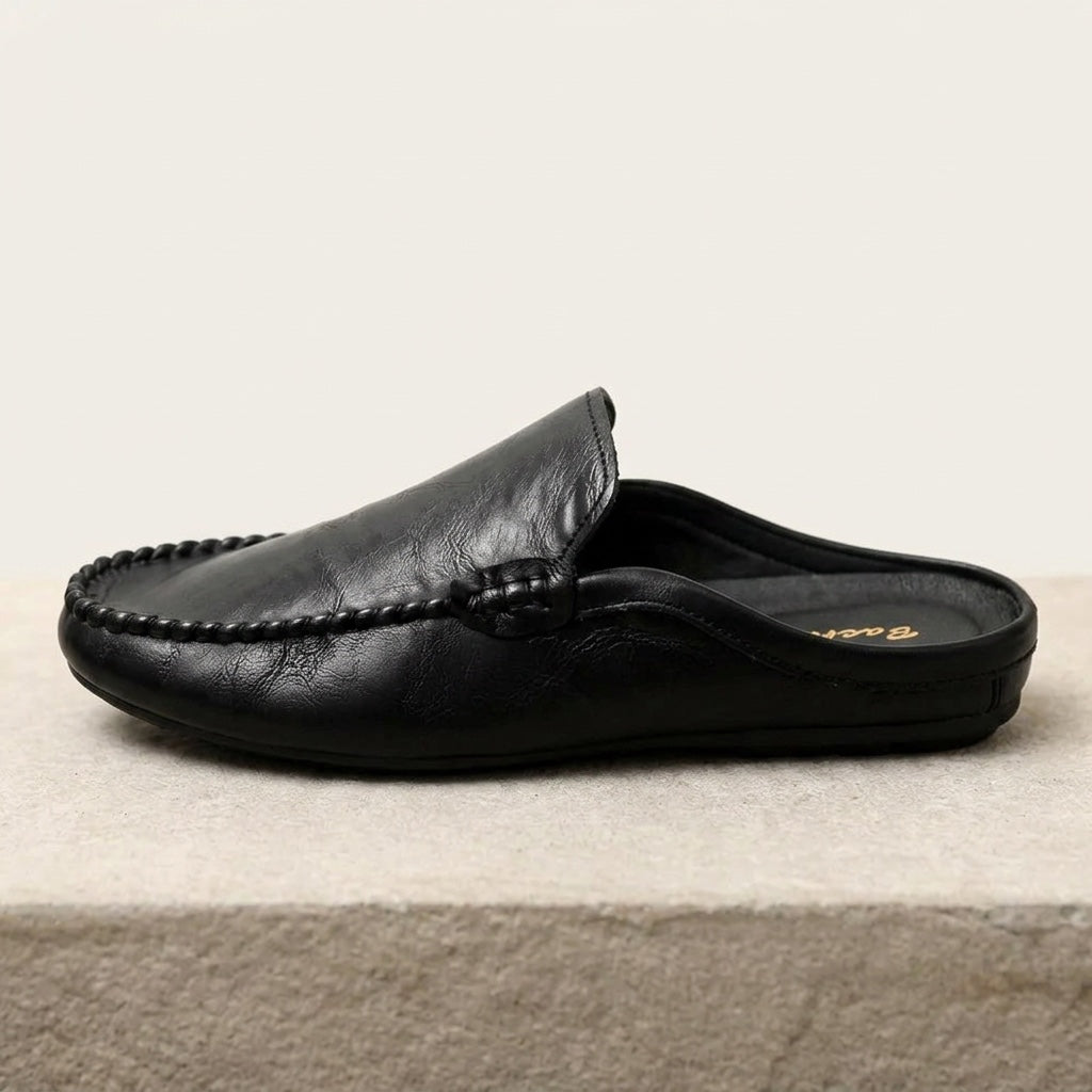 Cetara Leather Mules — Black, side profile studio view