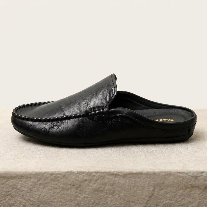Cetara Leather Mules — Black, side profile studio view