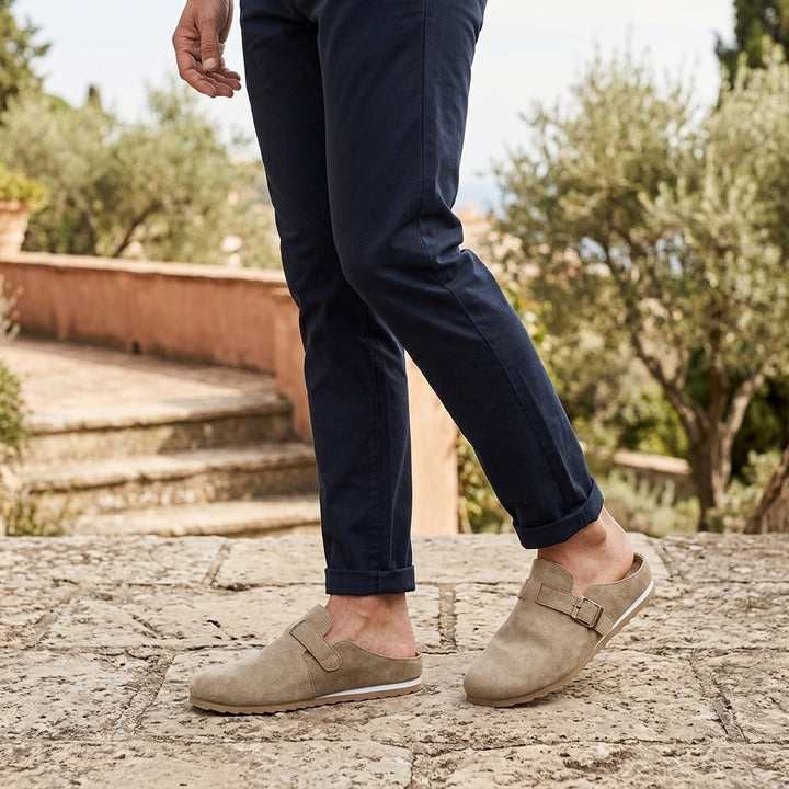 Ragusa Suede Mules — Sand, worn on model, garden terrace