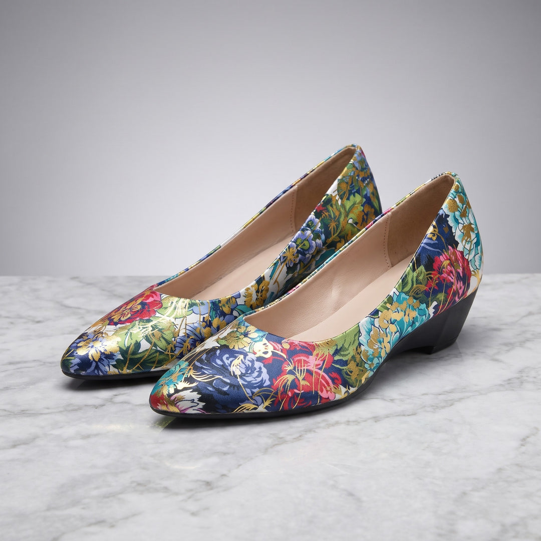 Camogli Floral Pumps — Teal Floral, pair in three-quarter view on light-grey marble