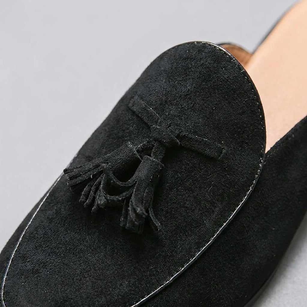 Fasano Suede Mules — Black, close-up tassel and vamp suede texture