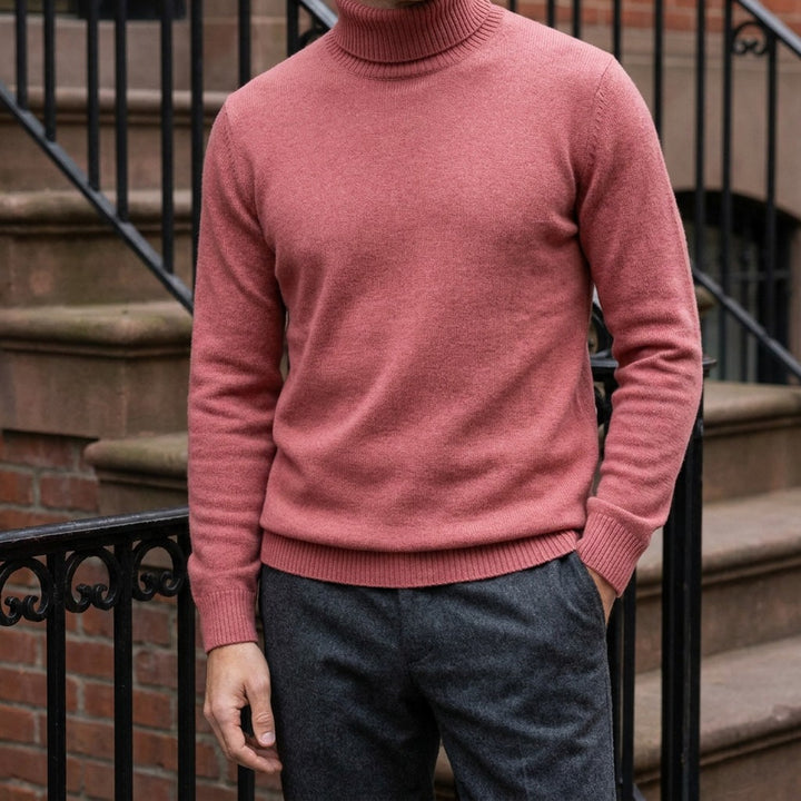 Cesena Merino Wool Turtleneck — Coral Red, worn on a brownstone stoop