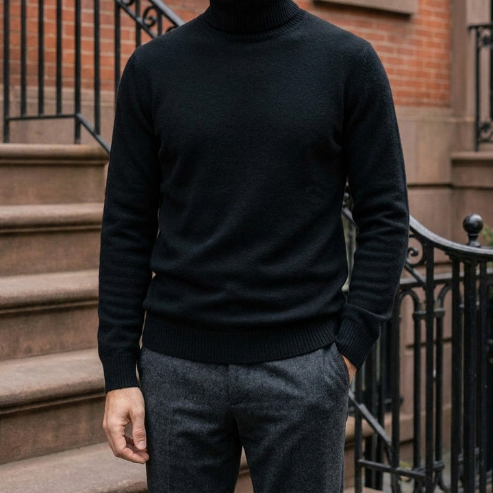 Cesena Merino Wool Turtleneck — Black, worn on a brownstone stoop