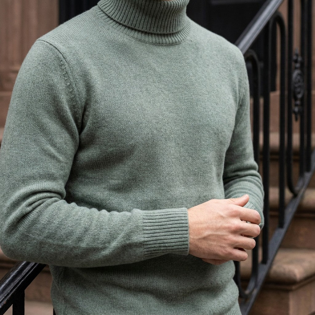 Cesena Merino Wool Turtleneck — Sage, worn close-up of the cuff and knit