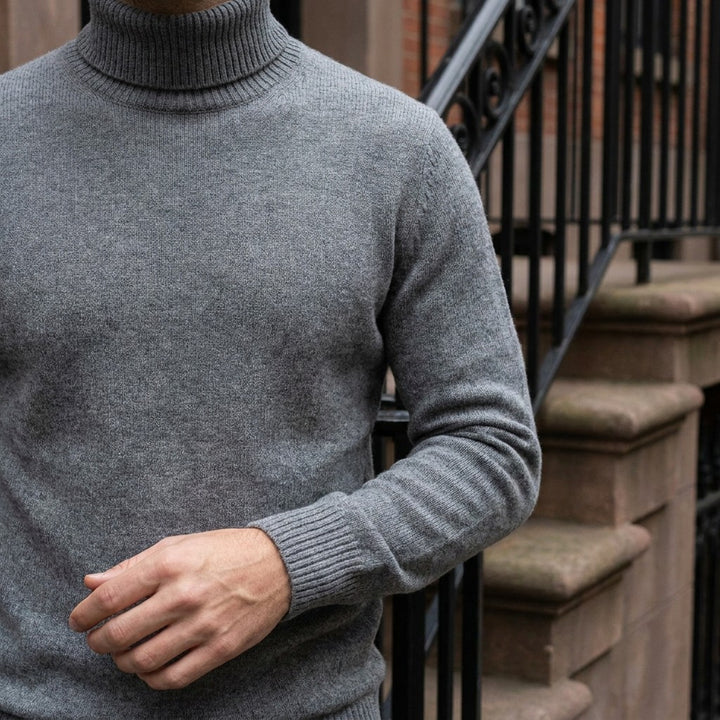 Cesena Merino Wool Turtleneck — Charcoal, worn close-up of the cuff and knit