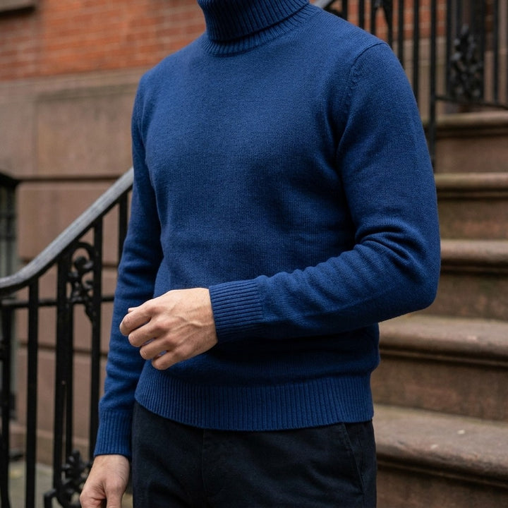 Cesena Merino Wool Turtleneck — Royal Blue, worn close-up of the cuff and knit
