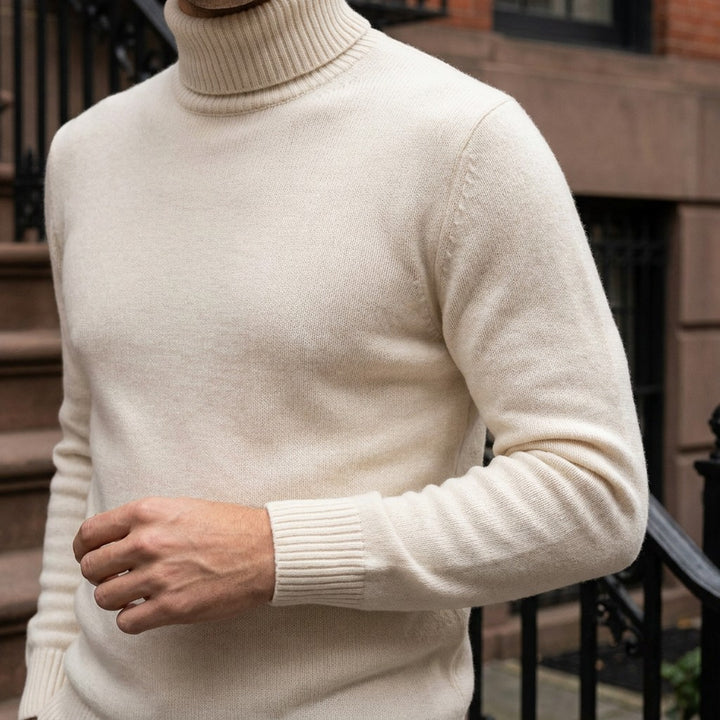 Cesena Merino Wool Turtleneck — Cream, worn close-up of the cuff and knit