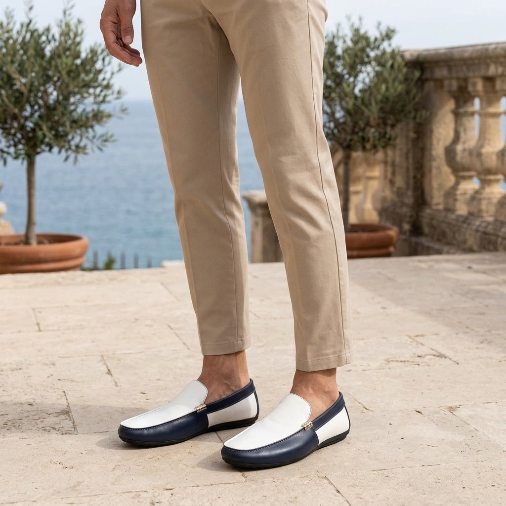 Salerno Two-Tone Loafers — Navy &amp; White, worn on a coastal stone terrace