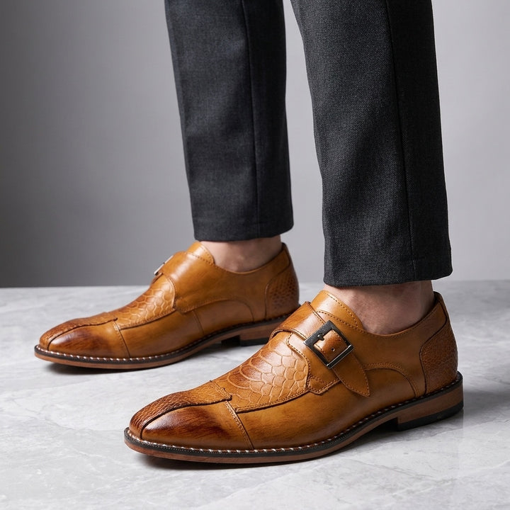 Arezzo Leather Monk Loafers — Camel, worn knee-down studio view