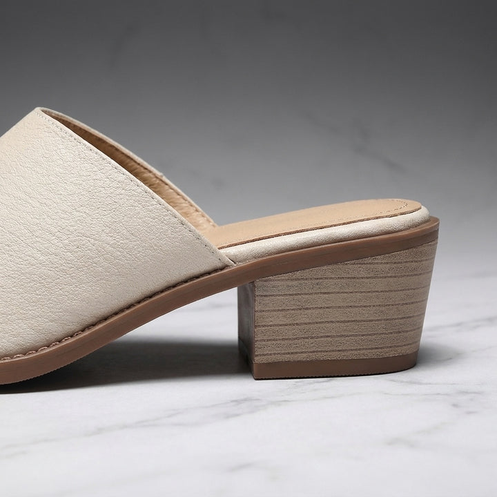 Sabina Leather Mules — Cream, close-up of the block heel and stitched sole edge
