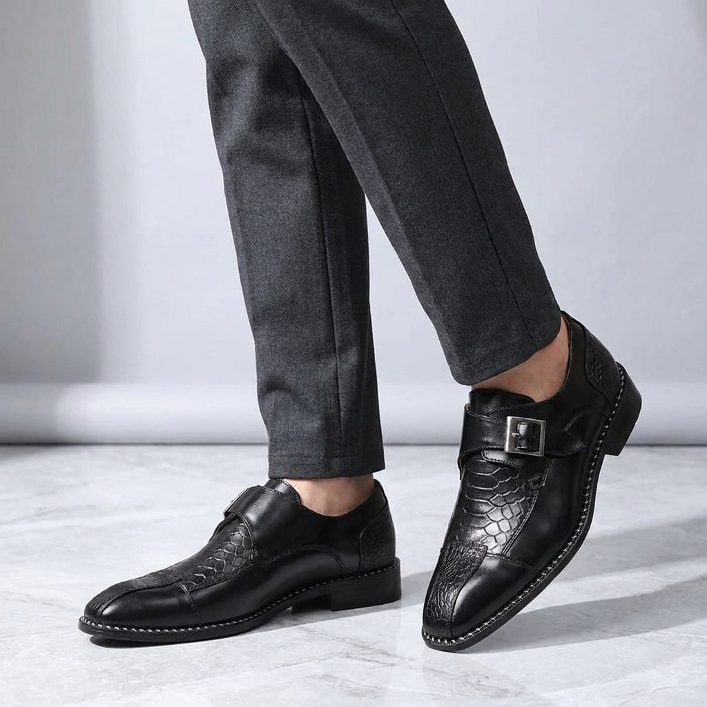 Arezzo Leather Monk Loafers — Black, worn knee-down studio view