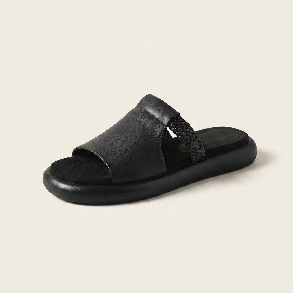 Marsala Leather Slides — Black, three-quarter studio view