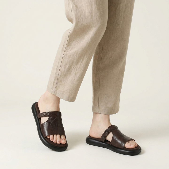 Marsala Leather Slides — Brown, knee-down studio model