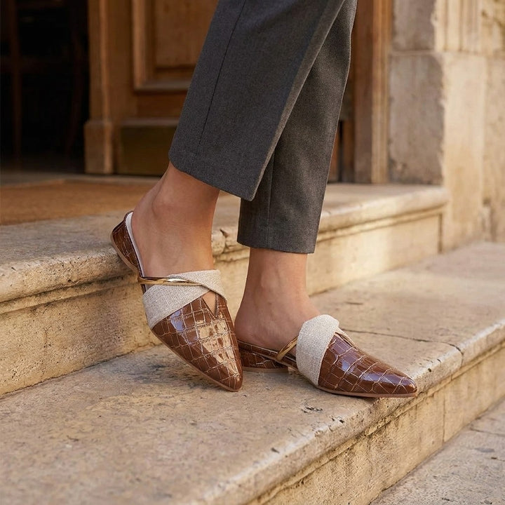 Orvieto Croc-Embossed Mules — Khaki, on model at restaurant steps