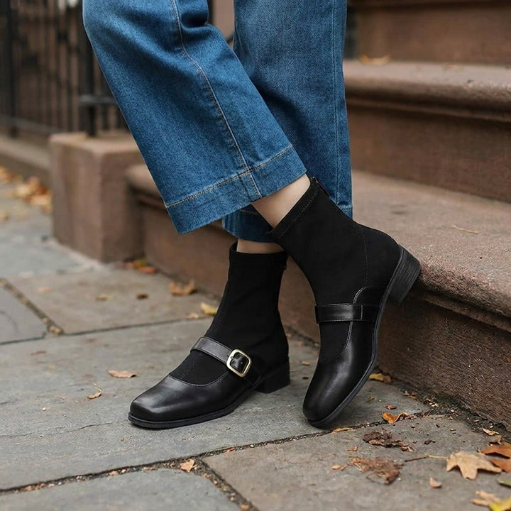 Pesaro Mary Jane Ankle Boots — Black, worn by a woman, knee down, on a Brooklyn brownstone sidewalk