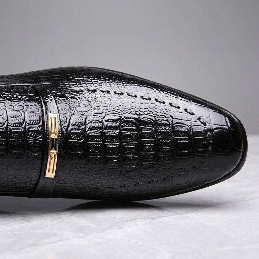 Snakeskin Loafers — Black, close-up of strap ornament and embossed texture