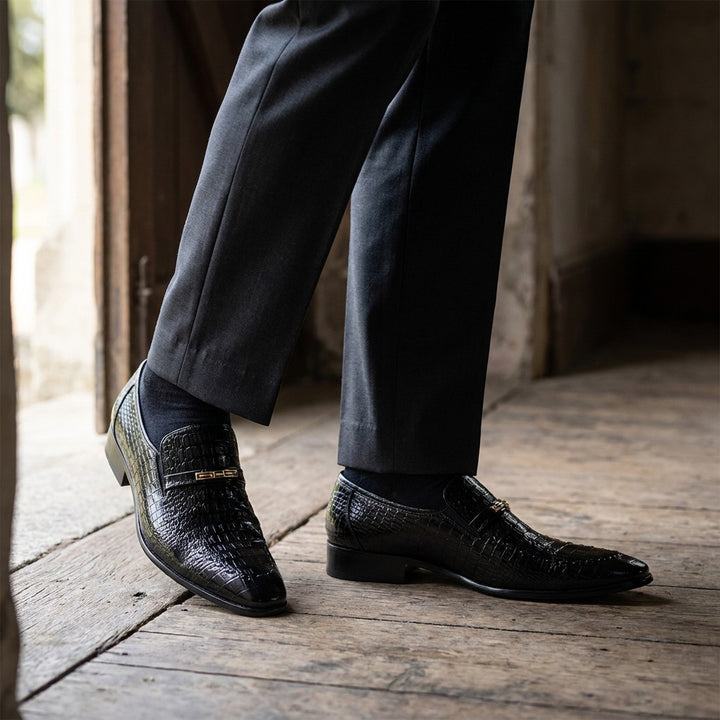 Snakeskin Loafers — Black, worn on foot, church foyer